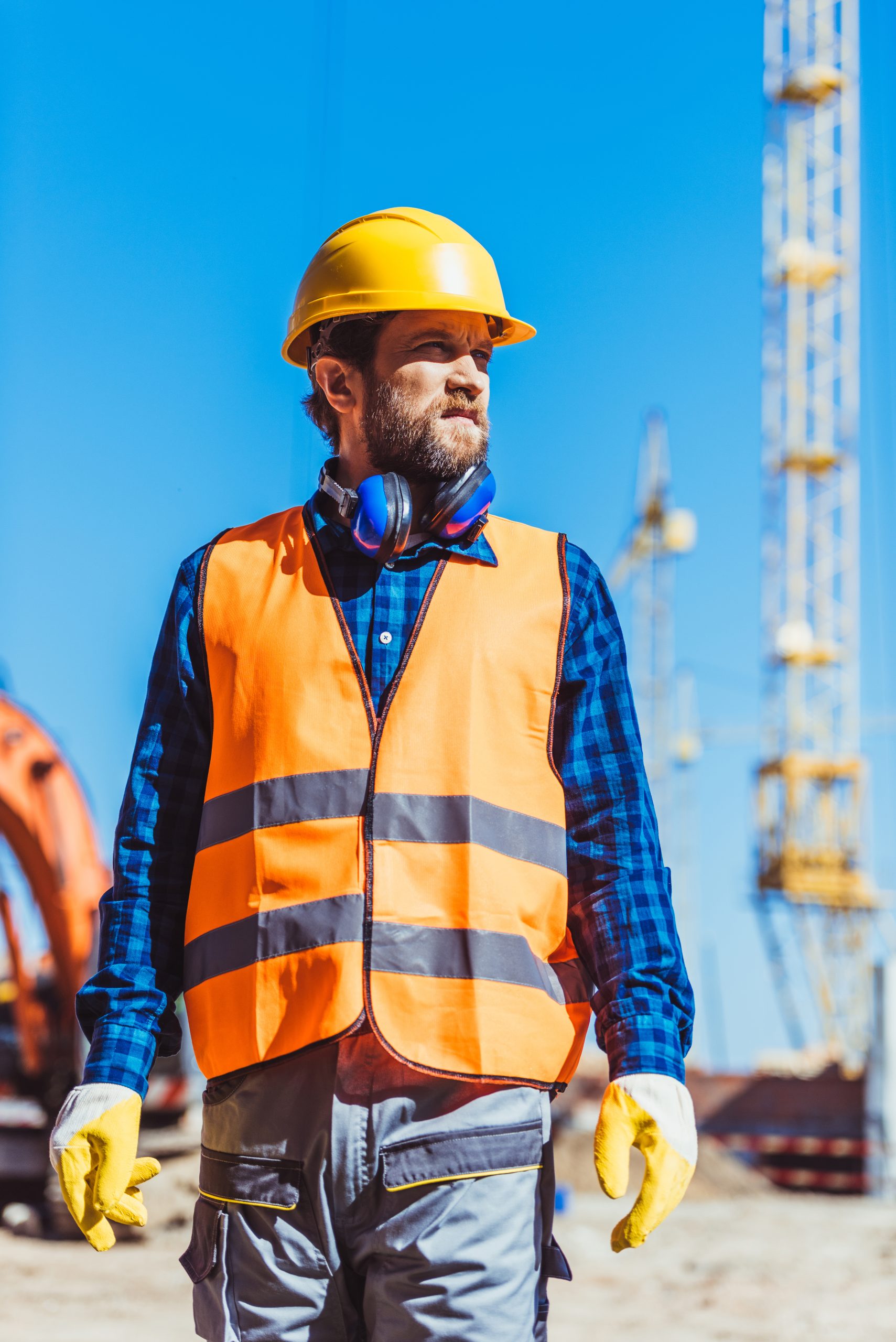 young builder in reflective vest and hardhat stand 2024 11 18 13 33 33 utc scaled